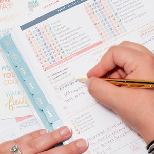 Home Planner opened and lady checking off water plants