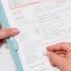 Home Planner and lady applying sticker from Sticker Book