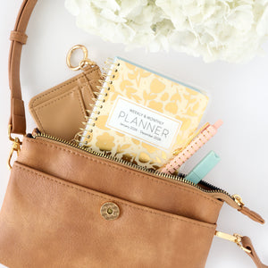 cream floral pocket calendar in purse