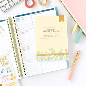 faith sticker book on top of home planner