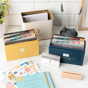 Menu Planning Starter Kit includes Slow Cooker Series, Freezer Series, Freezer Insert Cards, Recipe Tin, Wooden Block for recipes, Freezer Stand, and Menu Planning Sticker Book