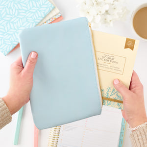 blue zipper pouch with sticker book