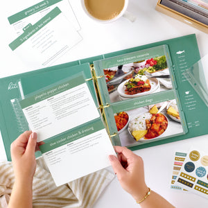 green recipe binder with recipe card being held