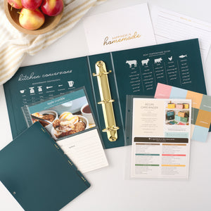 navy recipe binder with inserts, cards, and papers