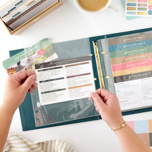 navy recipe binder with recipe card being held