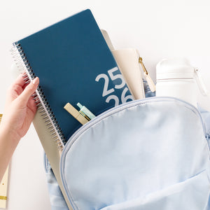 blue student planner in backpack