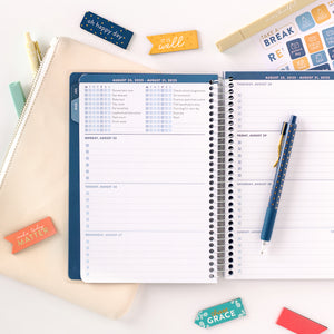 blue student planner with accessories