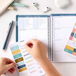 blue student planner stickers in being put on in planner