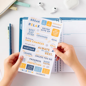 blue student planner stickers behind held
