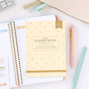 student sticker book on top of student planner