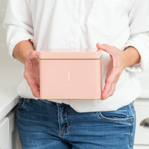 Lady holding Recipe Tin - Pink with "recipes" on front