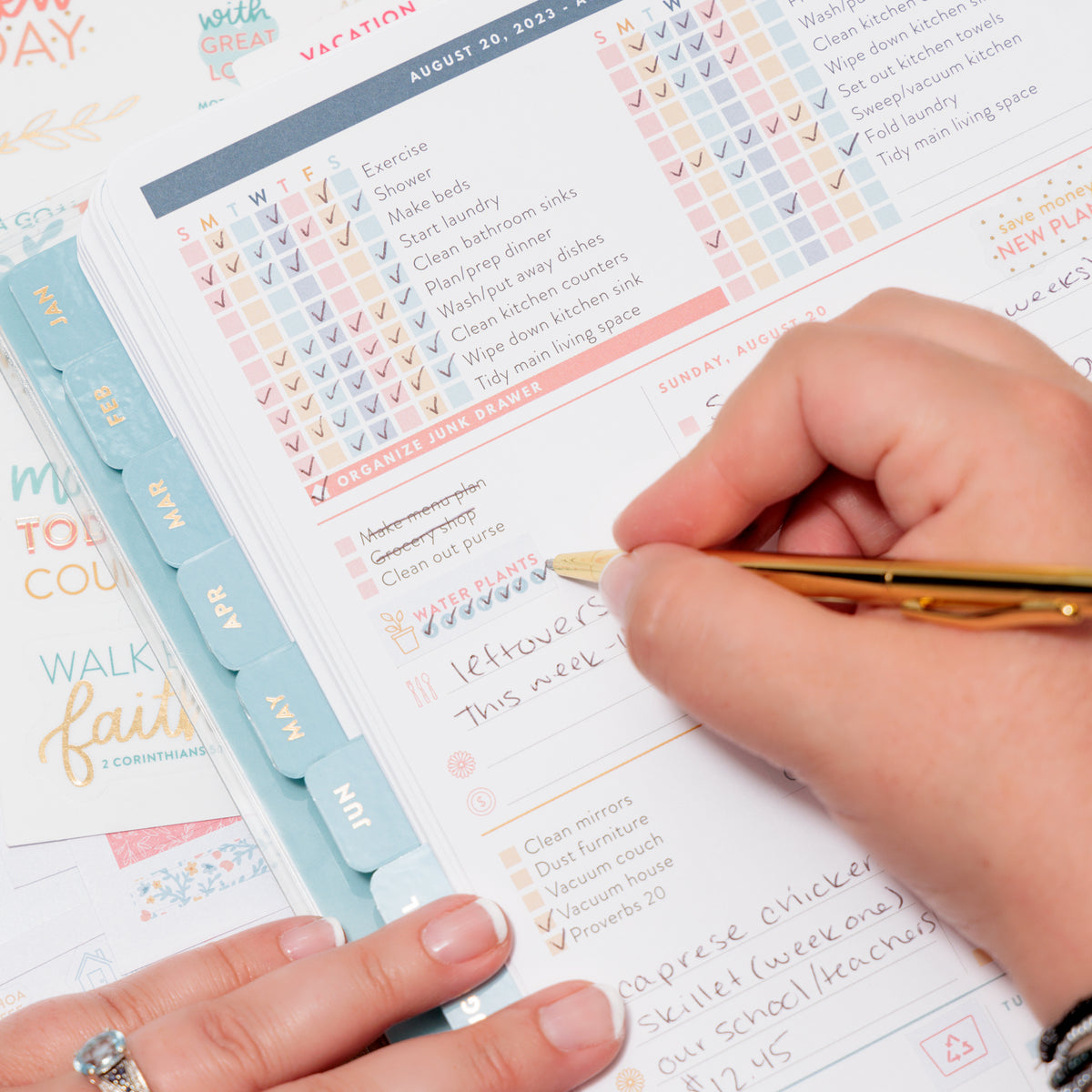 Home Planner opened and lady checking off water plants
