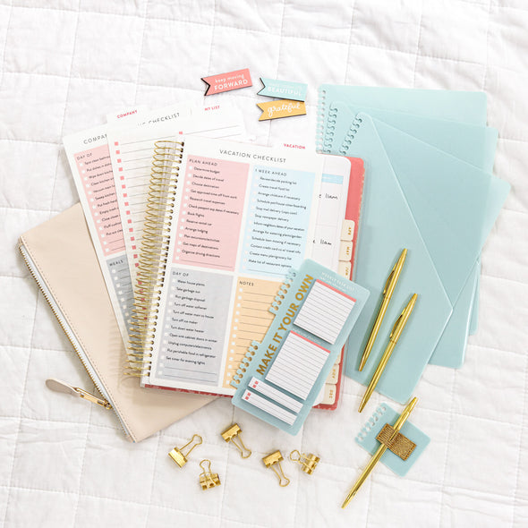 Accessories Kit includes pre-made sticky notes, dry-erase sheets,  binder clips, pens, magnetic bookmarks, and Weekly, Vacation and Company Coming Checklists