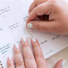 Lady adding bullet list sticker from Home Planner Sticker Book