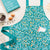 Kitchen Apron Collection in blue floral on kitchen counter