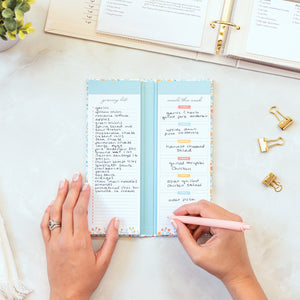 Lady filling out Meal Planning Notepad displaying Grocery List and Meals This Week