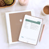 Binder containing downloaded menu plans and iPad with recipe