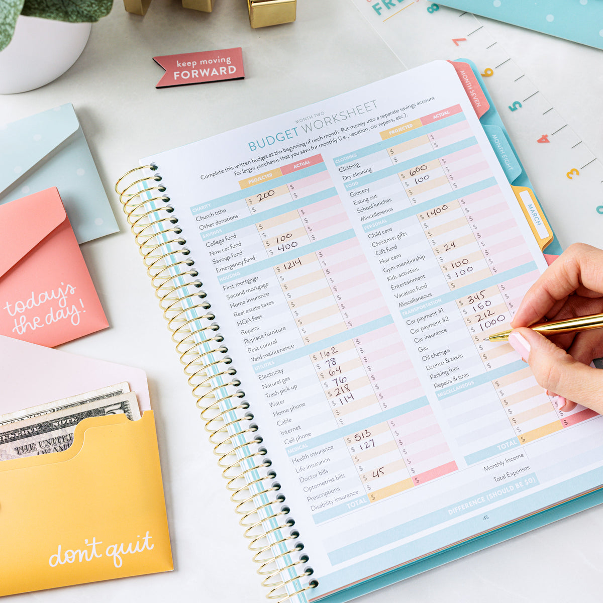 Money Planner Budget Worksheet and Envelopes on counter