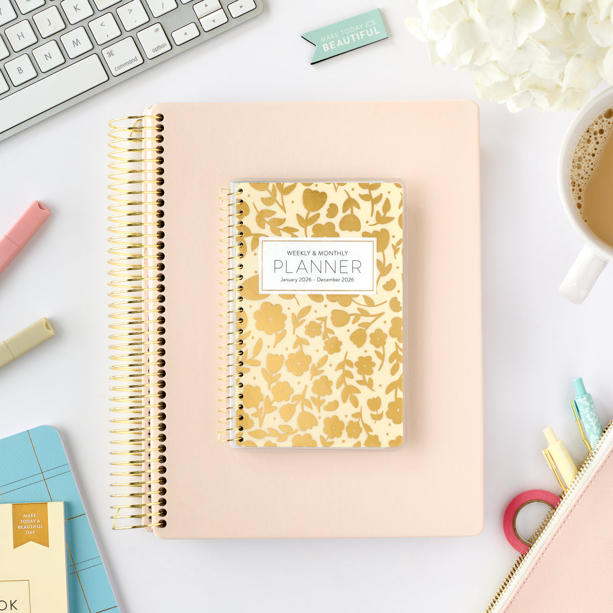 2026 gold floral pocket calendar on top of blush home planner