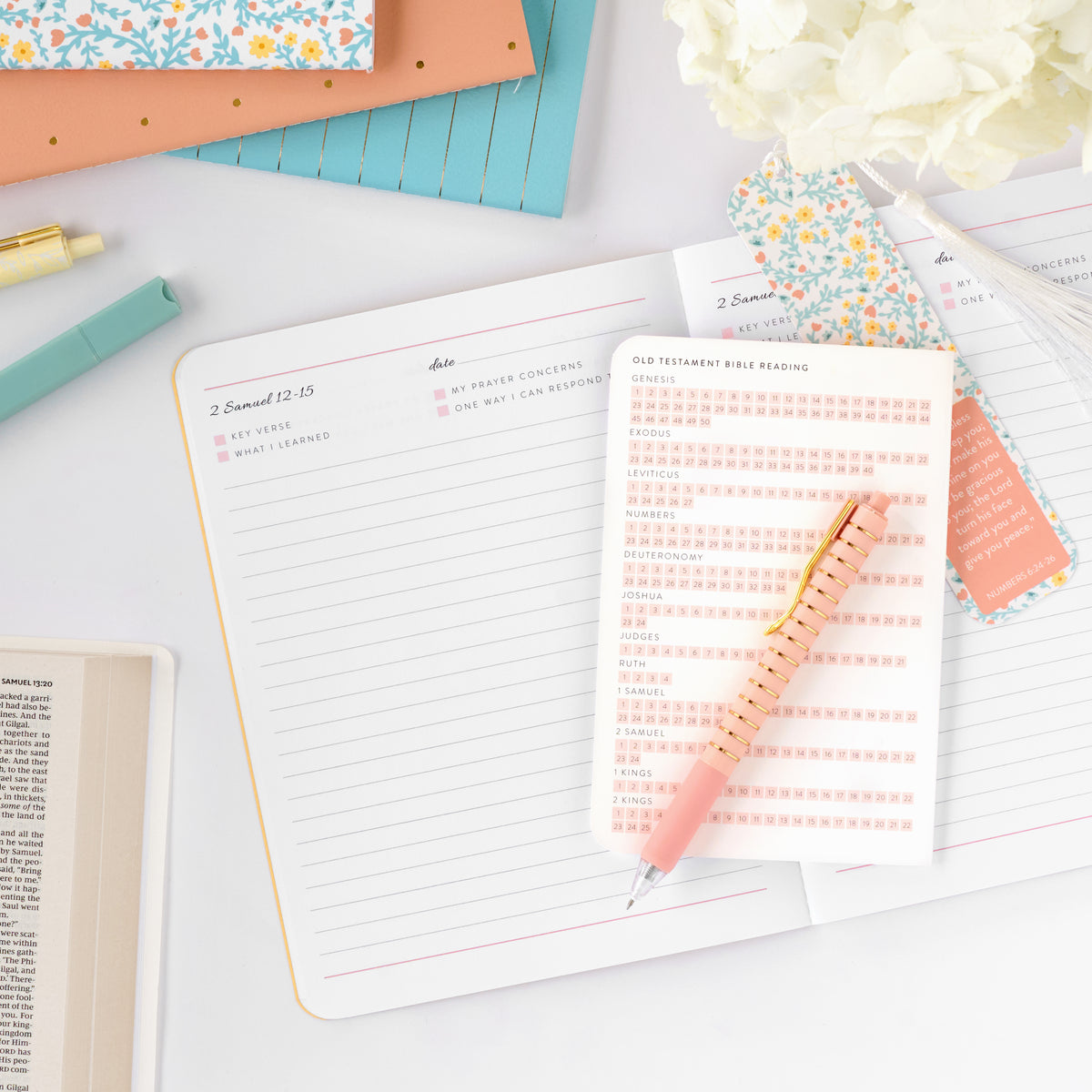 old testament journal on top of planner