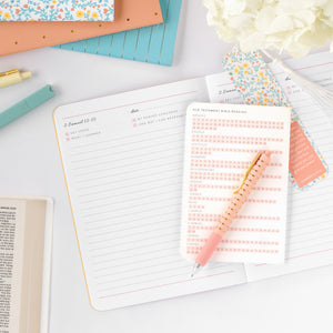 old testament journal on top of planner