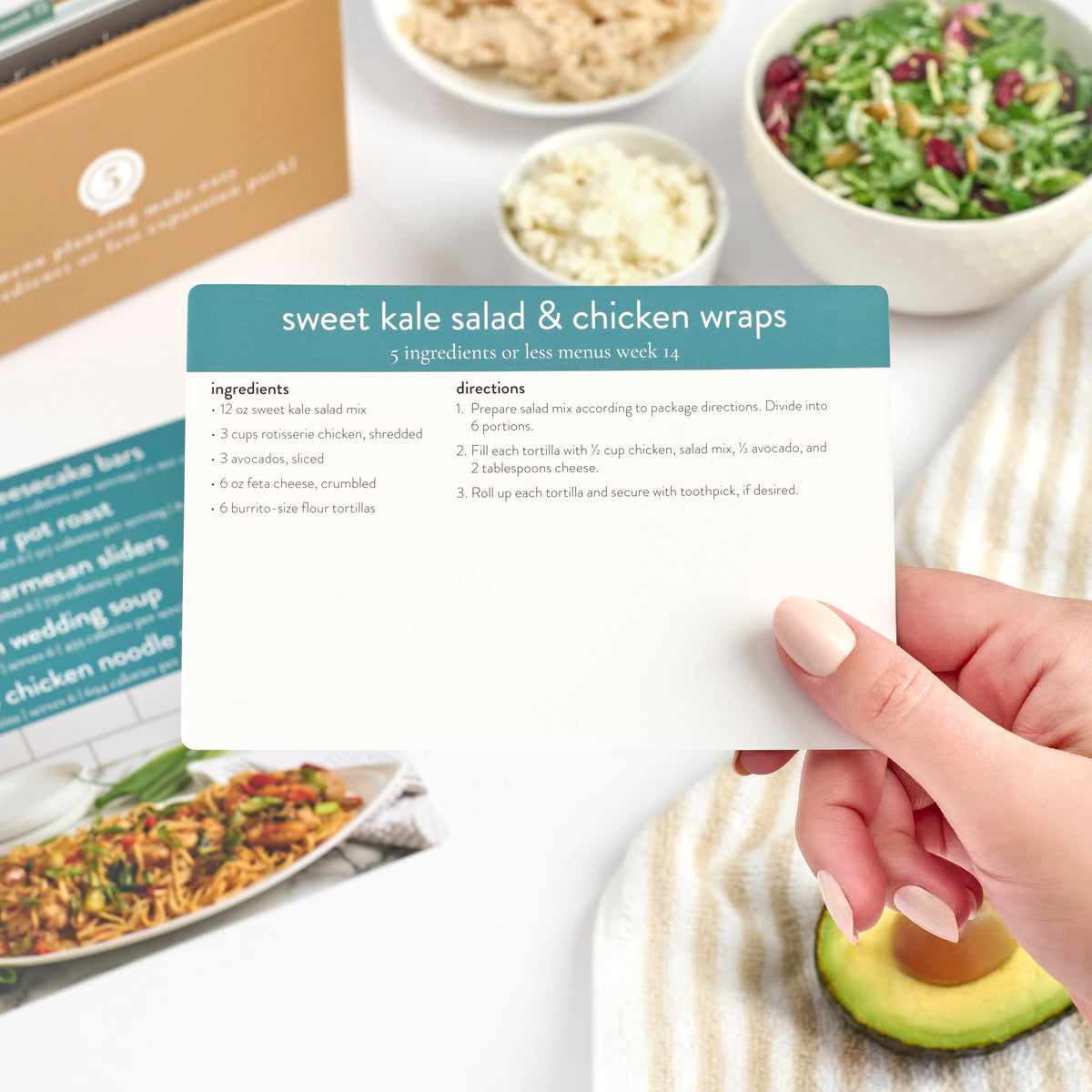 5 ingredients expansion box with sweet kale salad and chicken wraps recipe card close up