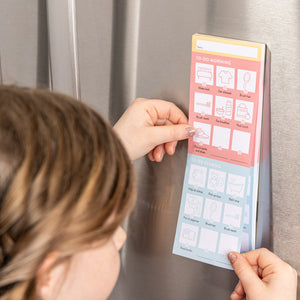 Chore Chart on refrigerator and child looking over lists