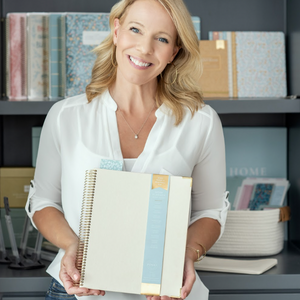 Lady holding Work Planner 