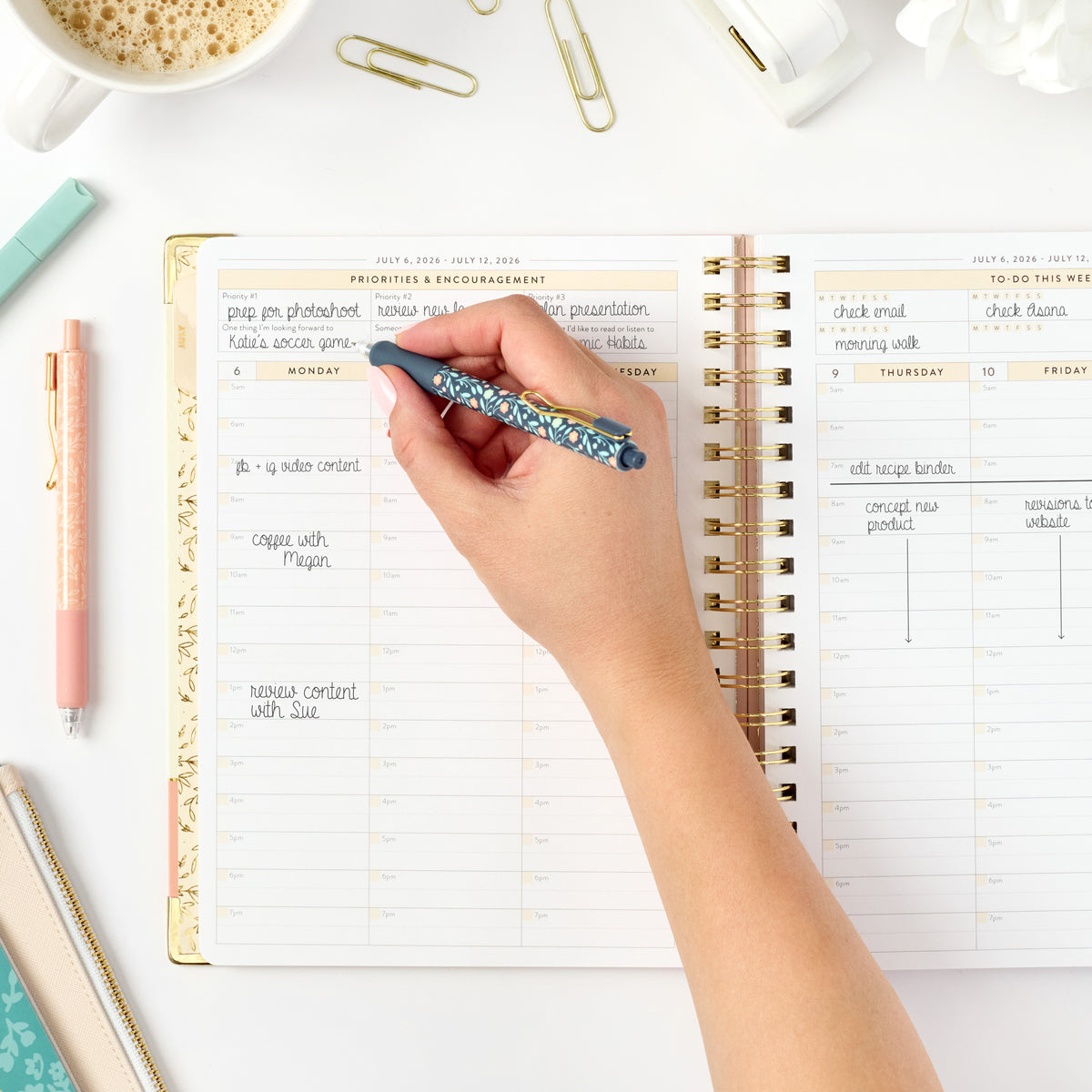 26-27 pink work planner being written in