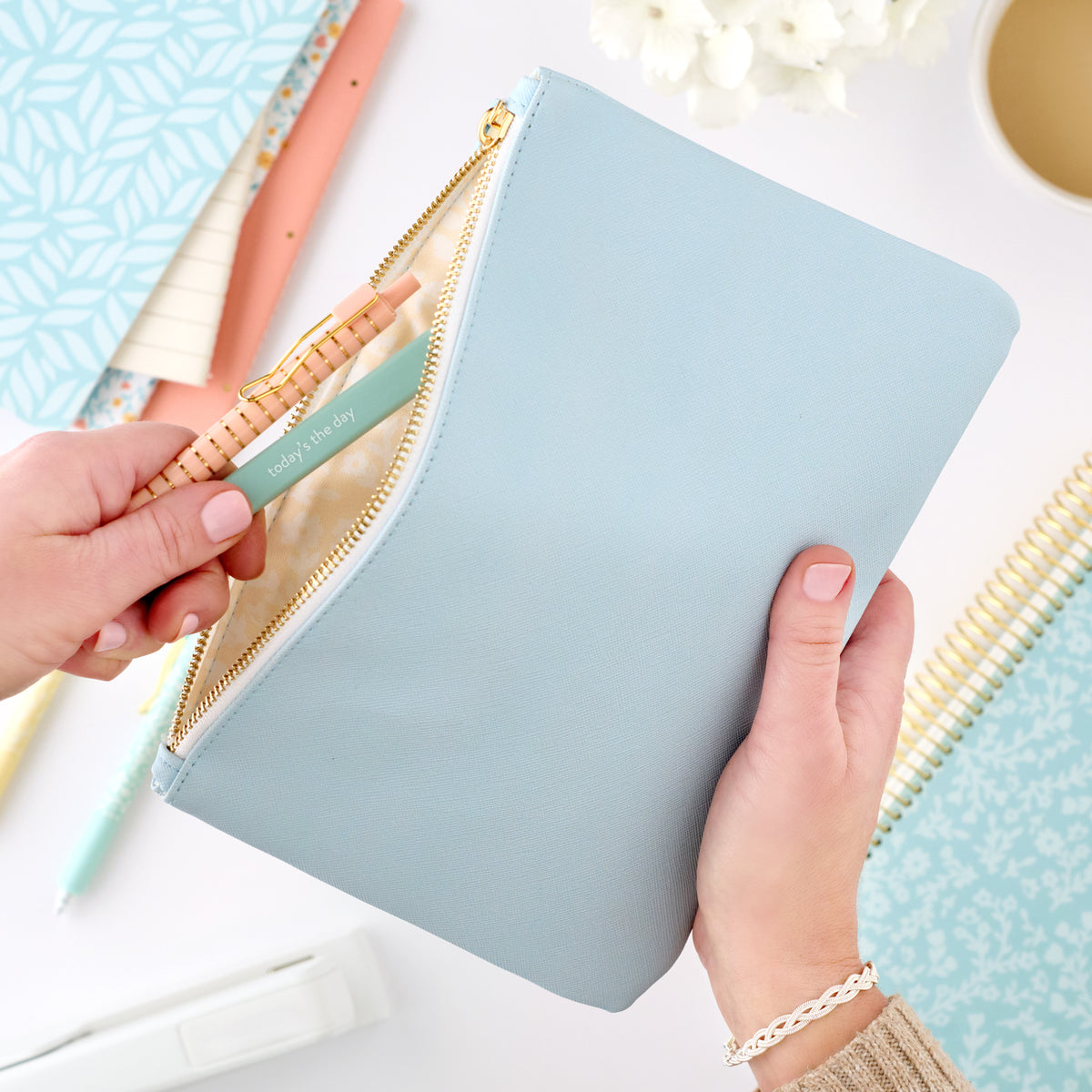 blue zipper pouch with pens