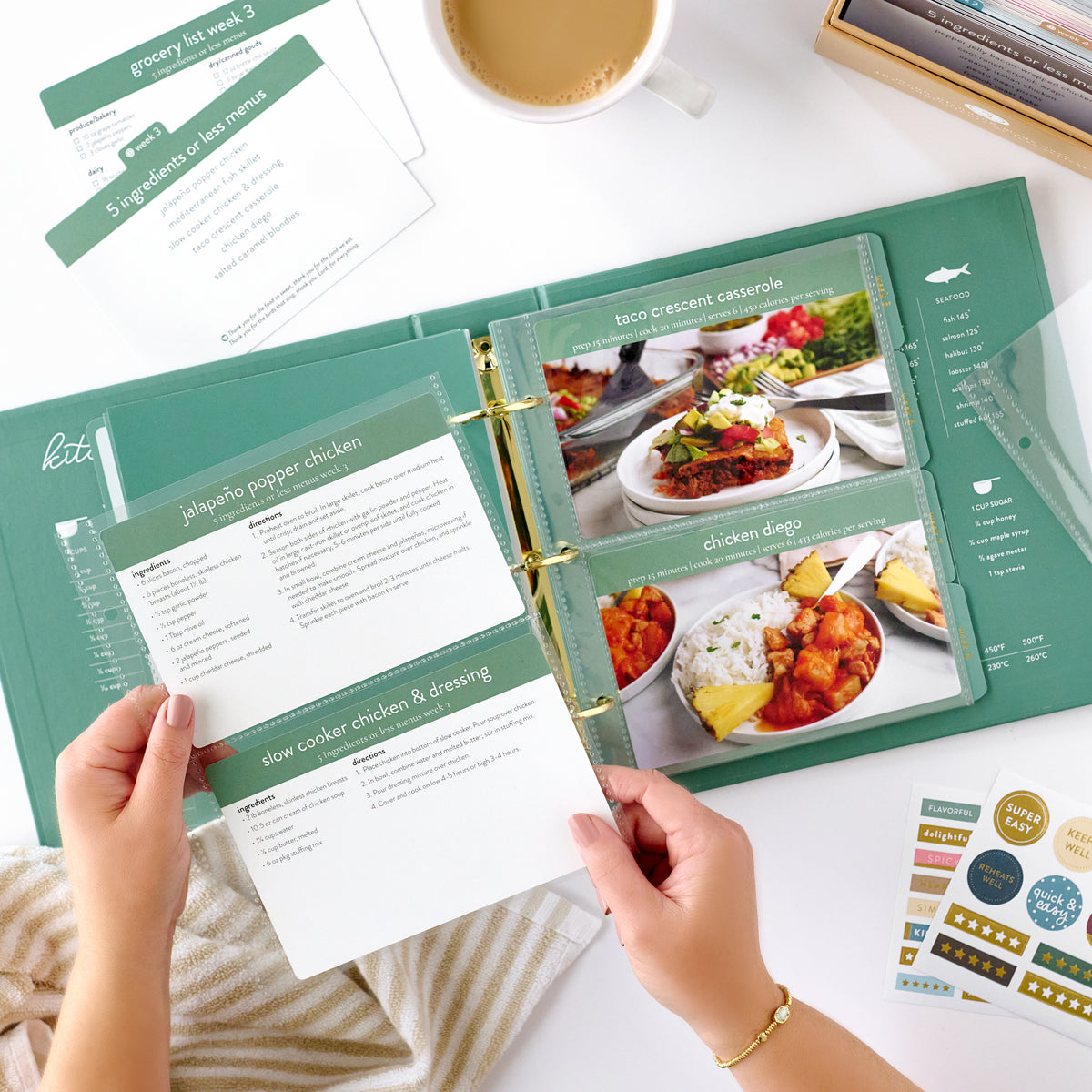 green recipe binder with recipe card being held