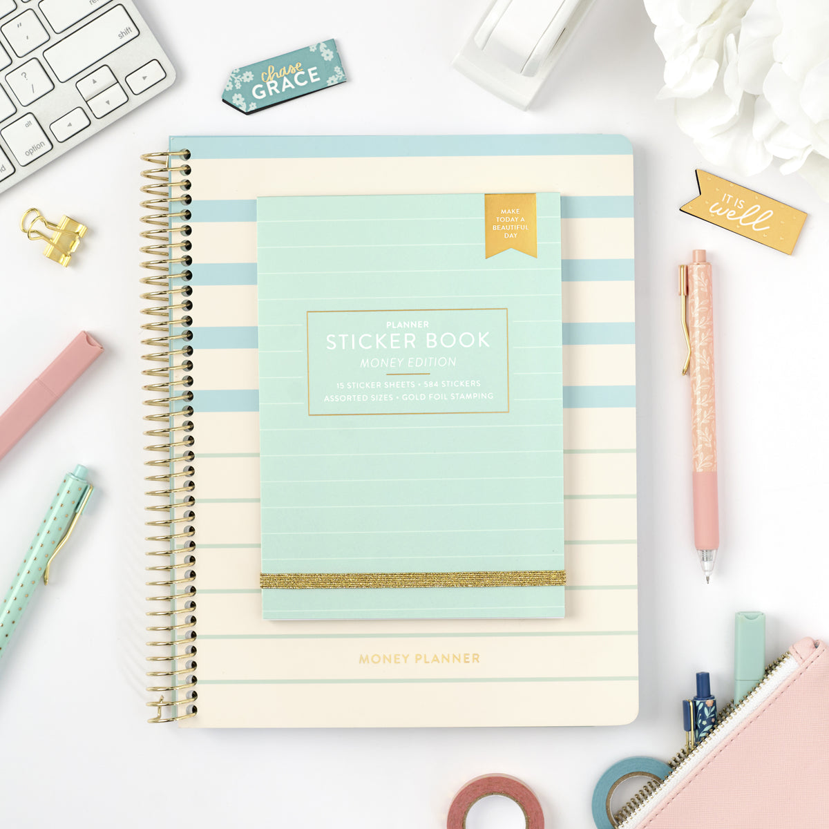 money sticker book on top of money planner