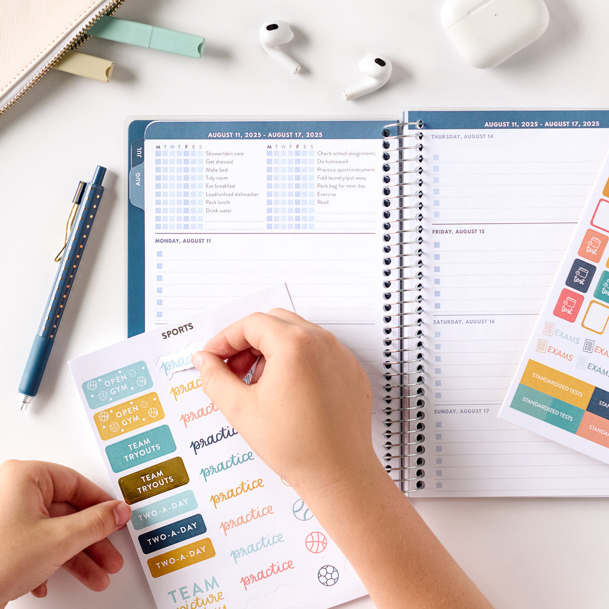 blue student planner stickers in being put on in planner