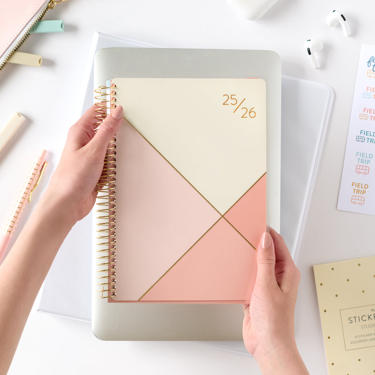 pink student planner being held