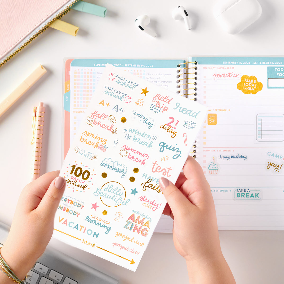 pink student planner stickers being held