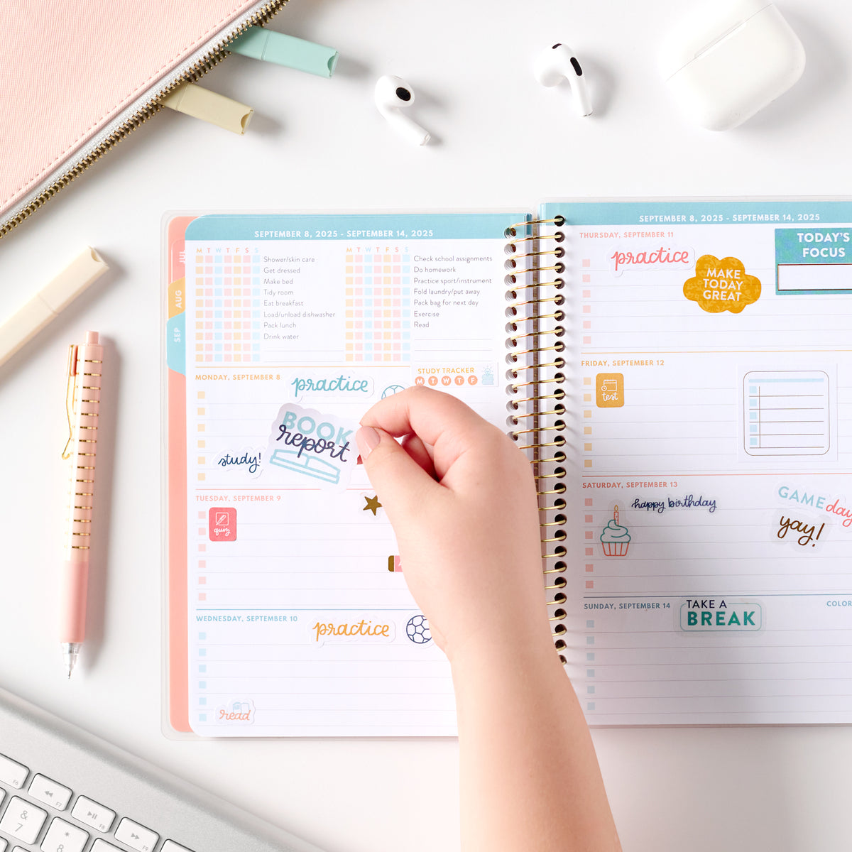 student stickers being put in planner