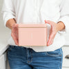Lady holding Recipe Tin - Pink  with "recipes" on front
