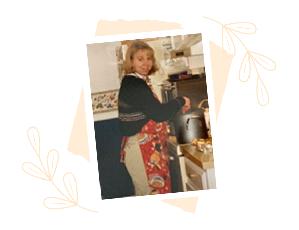 Laurie cooking in an early kitchen